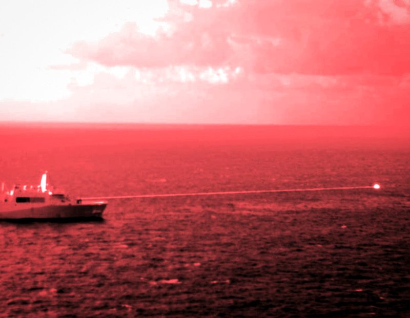 An infrared photo showing a boat shooting a laser